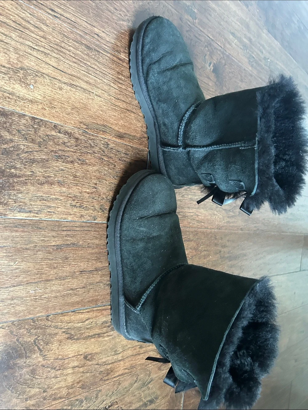 Women's UGG size 7 Black Suede Fur-Lined Ankle Boots with Bow Detail